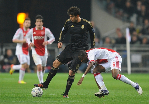 Kaká dribbling an opponent in Ajax vs Real Madrid