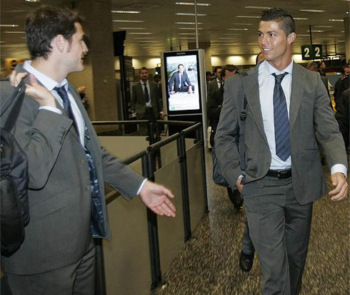 Cristiano Ronaldo and Iker Casillas travelling with the Real Madrid squad, in the club's grey suits