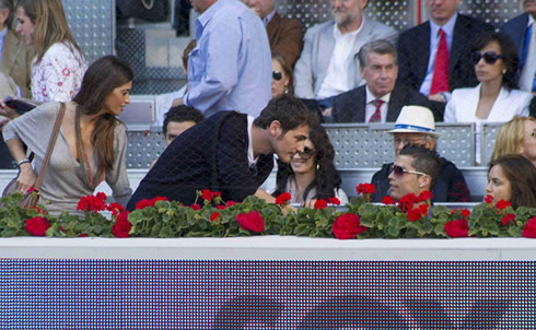 Cristiano Ronaldo and Irina Shayk, saluting Iker Casillas and Sara Carbonero in the audience of a tennis match