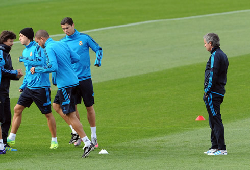 José Mourinho and Rui Faria watching Real Madrid squad training, including Ronaldo, Ozil and Pepe