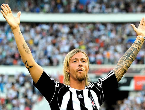 Guti raising his arms to celebrate a goal for Besiktas, in 2011