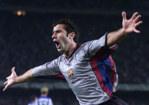 Luís Figo with a classic goal celebration for Barcelona, with his arms wide open