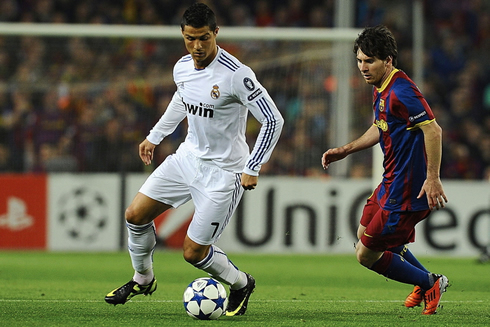 Cristiano Ronaldo dribbling Lionel Messi, in a Barcelona vs Real Madrid Clasico