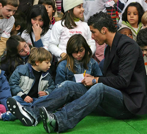 Cristiano Ronaldo helping kids