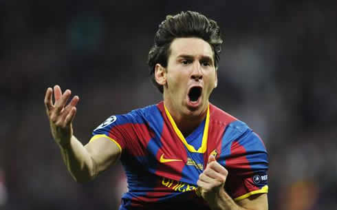 Lionel Messi celebrating a goal while holding Barcelona's shirt badge