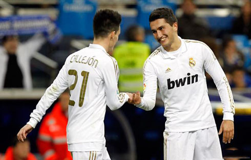 Callejón and Nuri Sahin smiling while celebrating a goal for Real Madrid