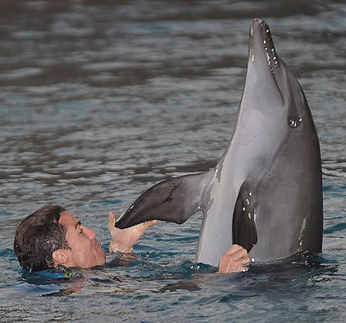 Cristiano Ronaldo playing with dolphins at the zoo marine sea, in Maldives