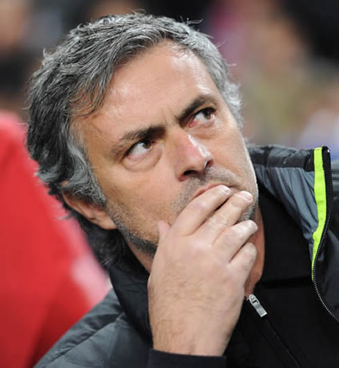 José Mourinho in a thoughtful pose, with his hand on his mouth