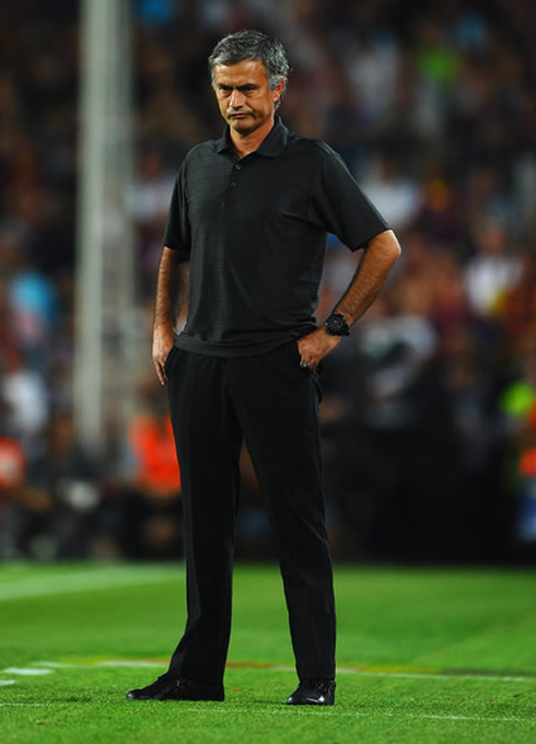 José Mourinho looking mad, in black jeans and a black polo