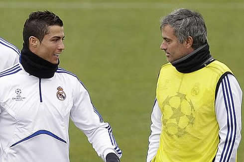 Cristiano Ronaldo smiling with José Mourinho in a Real Madrid practice in 2011