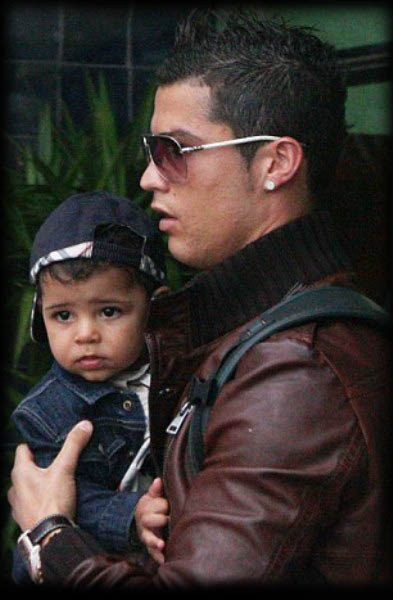 Cristiano Ronaldo holding his son