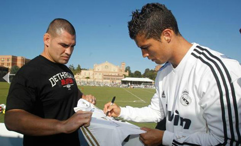 Cristiano Ronaldo signing shirt to Cain Velasquez