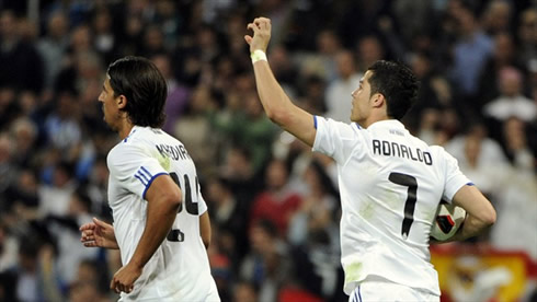 Cristiano Ronaldo celebrating a goal, running near Khedira