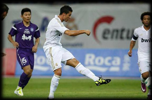 Cristiano Ronaldo scoring a goal against Tianjin Teda