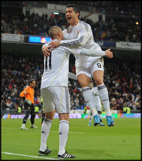 Cristiano Ronaldo jumping to Karim Benzema arms