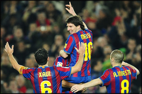 Messi and his Barcelona teammates, Xavi and Iniesta in 2011-2012