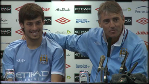 David Silva in a press conference sided by Robert Mancini, City coach