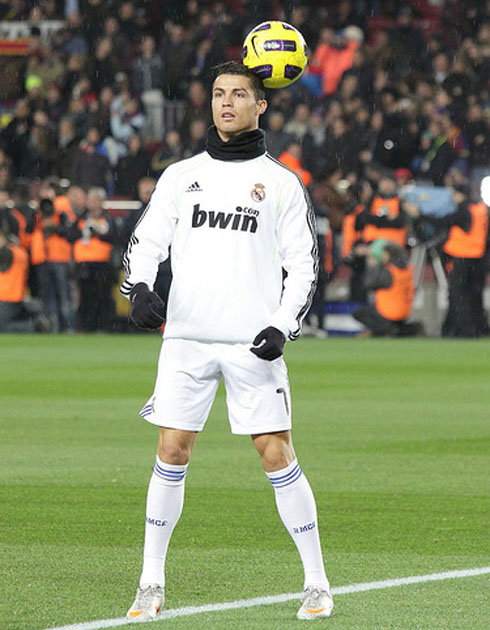 Cristiano Ronaldo doing tricks with the ball and holding it near his head