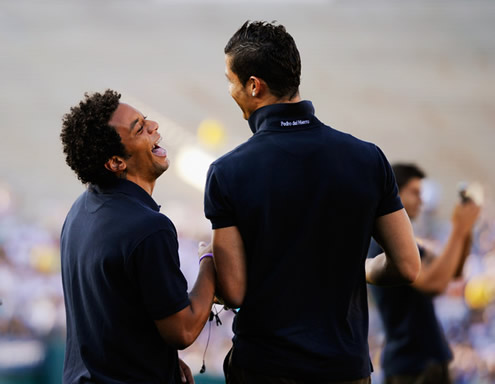 Cristiano Ronaldo laughing with Marcelo, showing they are really good friends off the pitch