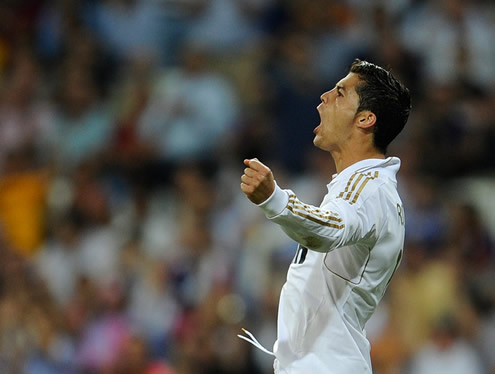 Cristiano Ronaldo celebrating another goal with joy and his arms wide open, at the Santiago Bernabéu in La Liga 2011/12