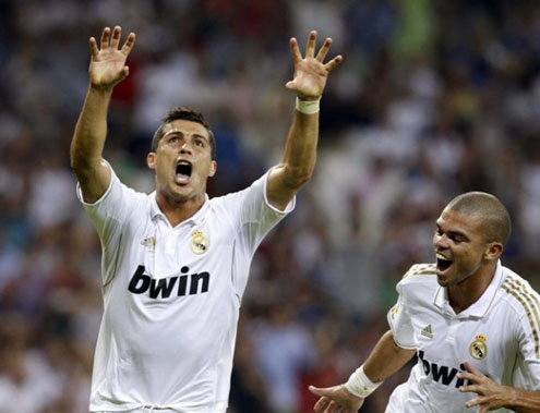 Cristiano Ronaldo dedicating the goal to his son, being chased by Pepe in the Santiago Bernabéu, during a Real Madrid game in 2011-2012
