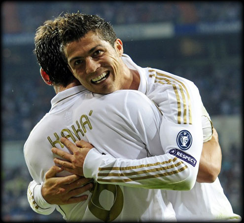 Cristiano Ronaldo with a funny face, while hugging Kaká after scoring a goal for Real Madrid in a UEFA Champions League match against Ajax, in 2011-2012