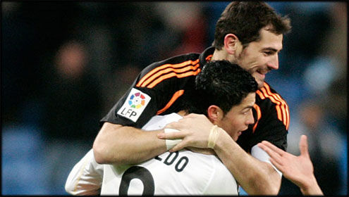 Cristiano Ronaldo and Iker Casillas hugging each other, proving that they are good friends in Real Madrid