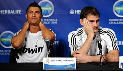 Iker Casillas and Cristiano Ronaldo looking distant, in a Real Madrid pre-season press conference in the United States