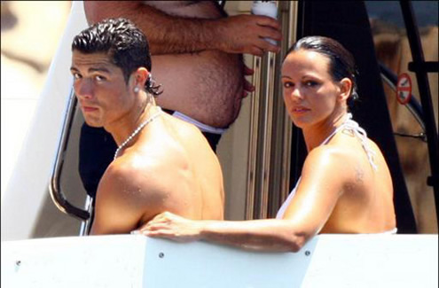 Cristiano Ronaldo and Nereida Gallardo looking upset by some paparazzi behind them