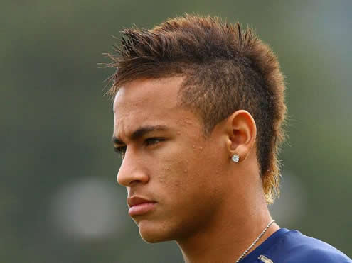 Neymar with a serious face and showing his special hairstyle and haircut