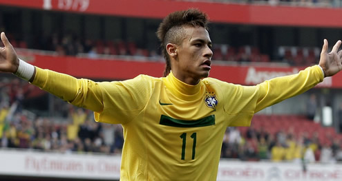 Neymar with arms wide open wearing Brazil's number 11 shirt