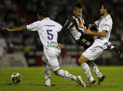 Neymar being fouled and flying in a match for Santos