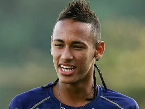 Neymar smiling with a short haircut and braids on the back of his hair