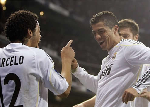 Cristiano Ronaldo dancing with Marcelo, with Xabi Alonso watching from behind