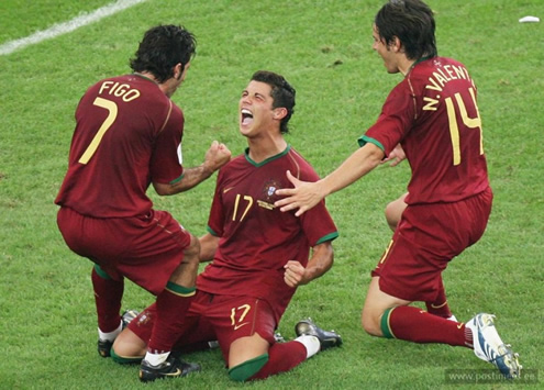 Cristiano Ronaldo on his knees, celebrating a Portugal goal with Luís Figo and Nuno Valente