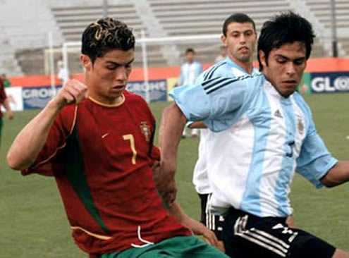 Cristiano Ronaldo playing for the Portuguese National Team in Portugal vs Argentina, when he was 17 years old, with Javier Mascherano on the back