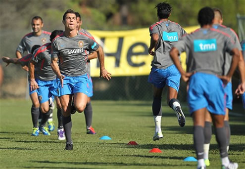 Cristiano Ronaldo sprinting in a practice session drill, while the new Nike black boots