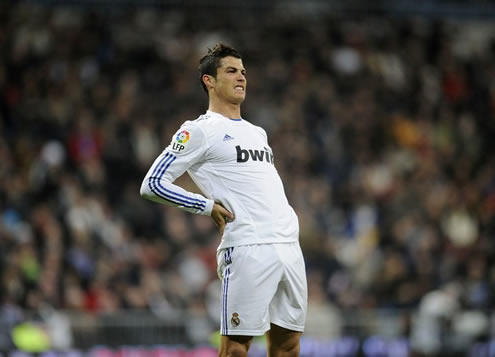 Cristiano Ronaldo stretching his back, in a Real Madrid game