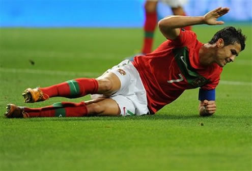 Cristiano Ronaldo tapping his hand on the grass, after being frustrated in the match between Portugal and Iceland, for the EURO 2012 Qualifiers stage