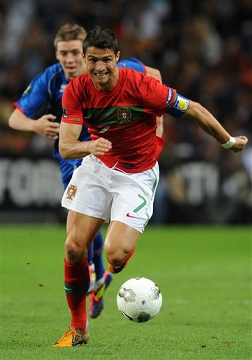 Cristiano Ronaldo running in a big sprint to chase the ball, in Portugal vs Iceland for the Euro 2012 Qualifiers