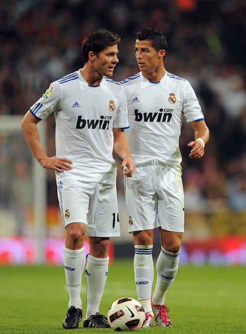 Cristiano Ronaldo and Xabi Alonso try to decide who will take the free-kick in Real Madrid 2010-2011