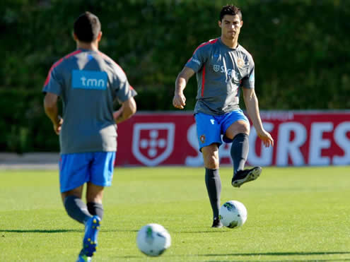 Cristiano Ronaldo in a Portugal practice session, making a pass with the new Nike black boots/shoes
