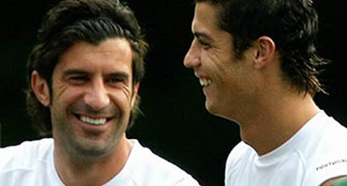 Cristiano Ronaldo and Luis Figo talking and smiling