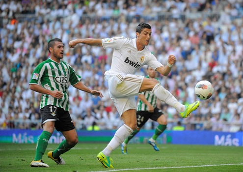 Cristiano Ronaldo attempt to reach the ball to shoot it with his right foot in Real Madrid vs Betis in La Liga 2011-2012