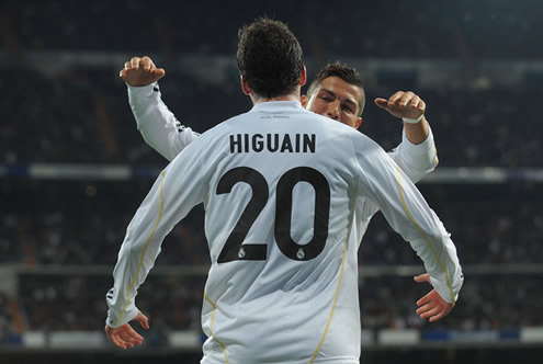Cristiano Ronaldo and Gonzalo Higuaín about to hug each other, in Real Madrid 2011/12