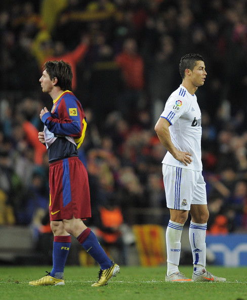 Lionel Messi and Cristiano Ronaldo side by side in a Barcelona vs Real Madrid 