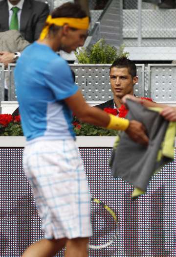 Cristiano Ronaldo watching a Rafael Nadal tennis game