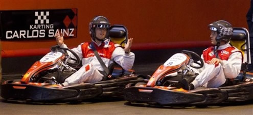 Cristiano Ronaldo and Kaká driving their cars in a karting race