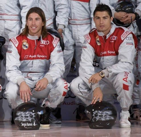 Sergio Ramos and Cristiano Ronaldo posing for a photo in their automobile uniform