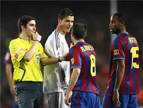 Cristiano Ronaldo and Iniesta exchanging words in a Barcelona vs Real Madrid 